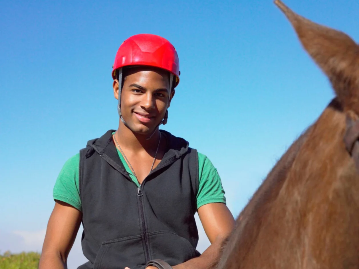 teen boy riding a horse — teen wellness concept and equine therapy